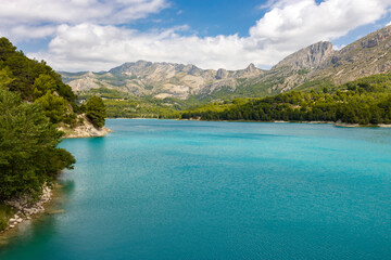 view of lake between mountains