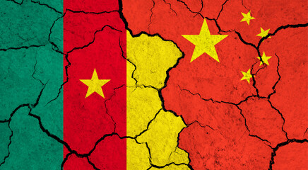 Flags of Cameroon and China on cracked surface - politics, relationship concept