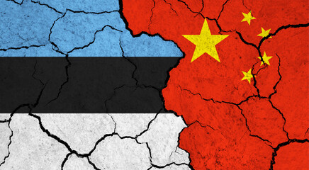 Flags of Estonia and China on cracked surface - politics, relationship concept