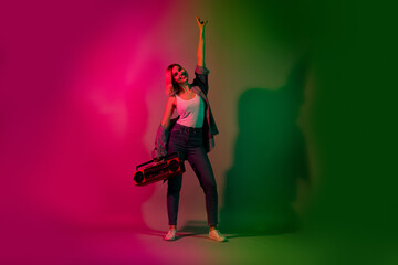 Full body photo of positive futuristic lady youth have holiday on nightclub event with boom box isolated on multicolor neon color background