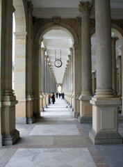 Karlovy Vary, Czech Republic - 04.03.2013. Passers-by on Mlynskaya (Melnichnaya) embankment