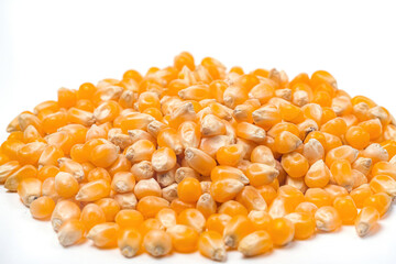 popcorn made of raw corn kernels on a white background