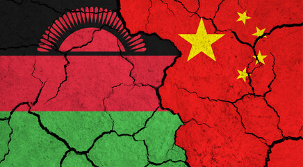 Flags of Malawi and China on cracked surface - politics, relationship concept