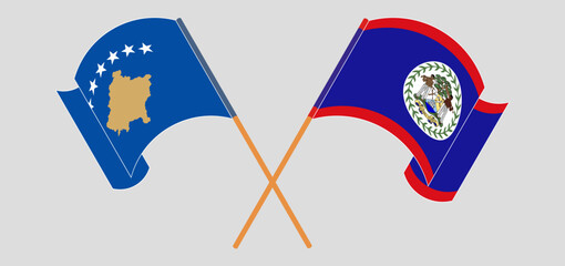 Crossed and waving flags of Kosovo and Belize