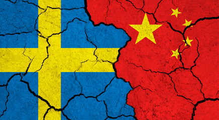 Flags of Sweden and China on cracked surface - politics, relationship concept