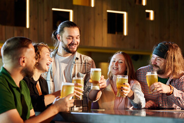 Friends, men and women attending pub, bar, watching sport match translation, drinking beer, cheering up favourite team. Concept of sport competition, hobby, lifestyle, human emotions, fun