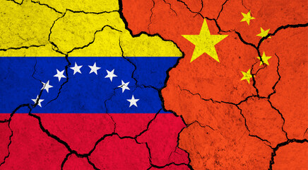 Flags of Venezuela and China on cracked surface - politics, relationship concept