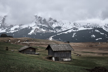  touristic houses. misty fog wooden travel cabin on the hills. Alpe di siusi, Seiser alm Italian.