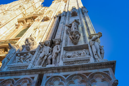Italy, Milan, 5.3.2018: Fasal of the Milan Cathedral with sharp shminis and sculptures on the walls