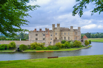 Fototapeta na wymiar England, Leeds, 15.6.2017: Leeds Castle in not very good weather with a gray sky but with a beautiful view of the lake