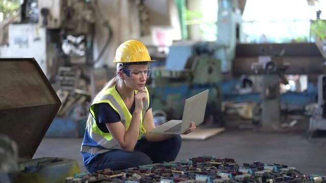 caucasian engineer woman checking and inspecting electronic components for industrial technology parts in factory. worker female quality control spare part machine in warehouse Workshop checking stock