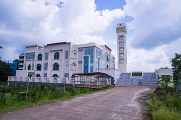 Most Beautiful architecture Model Mosque in Bangladesh with a White cloudy Blue sky