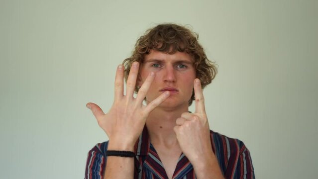 man showing six fingers 