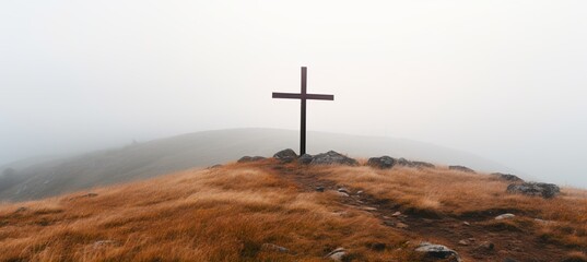 Cross at the foggy mountain background. Generative AI technology.