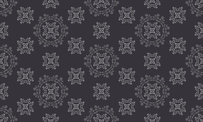 circular ornament of leaves on a dark gray background. original seamless wallpaper. silver decorative embossing. design for media and social networks, printed products. pattern. horizontal cover.