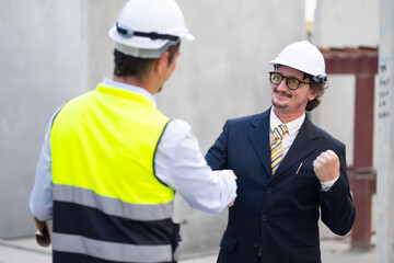 Business People shaking hands on business cooperation agreement. Successful hand shaking after good deal Heavy Industry Manufacturing Factory. Prefabricated concrete walls