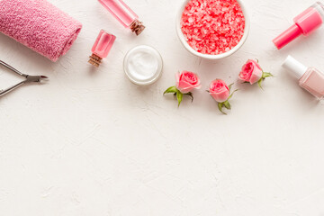 Hands and nails care set with manicure tools and roses flowers.