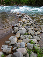 The embankments on the river are made of stone.