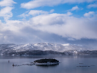 Obraz premium A scenic view in winter from Gisund Bridge, connecting Senja Island and mainland. Norway, Scandinavia. Northern Europe