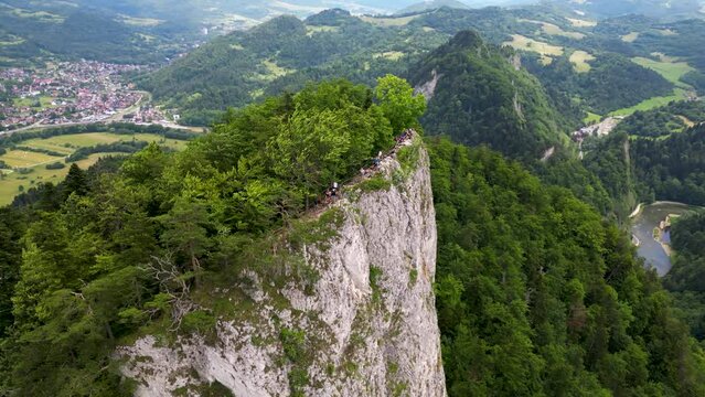 People on top of Sokolica (Falcons' Rock) and Dunajec river in Pieniny, Poland