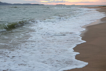 Obraz premium Raging Sea with Sunset Sky Background