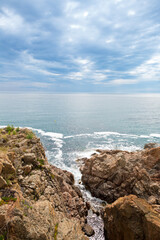 Fototapeta na wymiar Rocks and rough sea on the Catalan Costa Brava