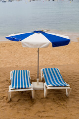 hammocks and umbrella on a sandy beach