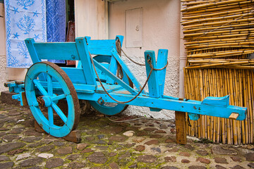 old light blue wooden cart for transporting various goods