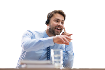 Cheerful young support phone male operator in headset, at workplace while using computer, help service and client consulting call center concept on a transparent background.