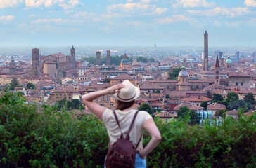 young tourist looking at the panorama of bologna