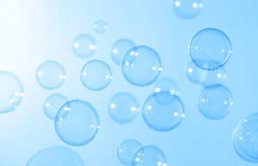 Beautiful Transparent Blue Soap Bubbles Floating in The Air. Abstract Blurred Background. Celebration Festive Backdrop.  Soap Suds Bubbles Water	
