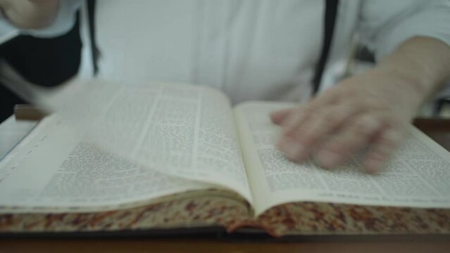 Jewish man read from the Jewish Bible Torah