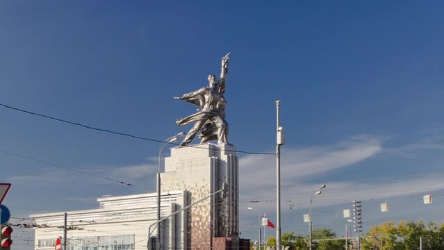 Industrial Worker and Collective Farm Girl monument from road with car traffic on intersection, timelapse hyperlapse Moscow, Russia