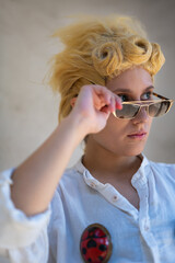 Italian girl cosplay Giorno Giovanna from the anime jojo. Blond woman with blue eyes. Close up to...