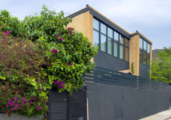 Fence at a suburb house. Villa in Los Monasterios Urbanization residential. Design house and luxury...
