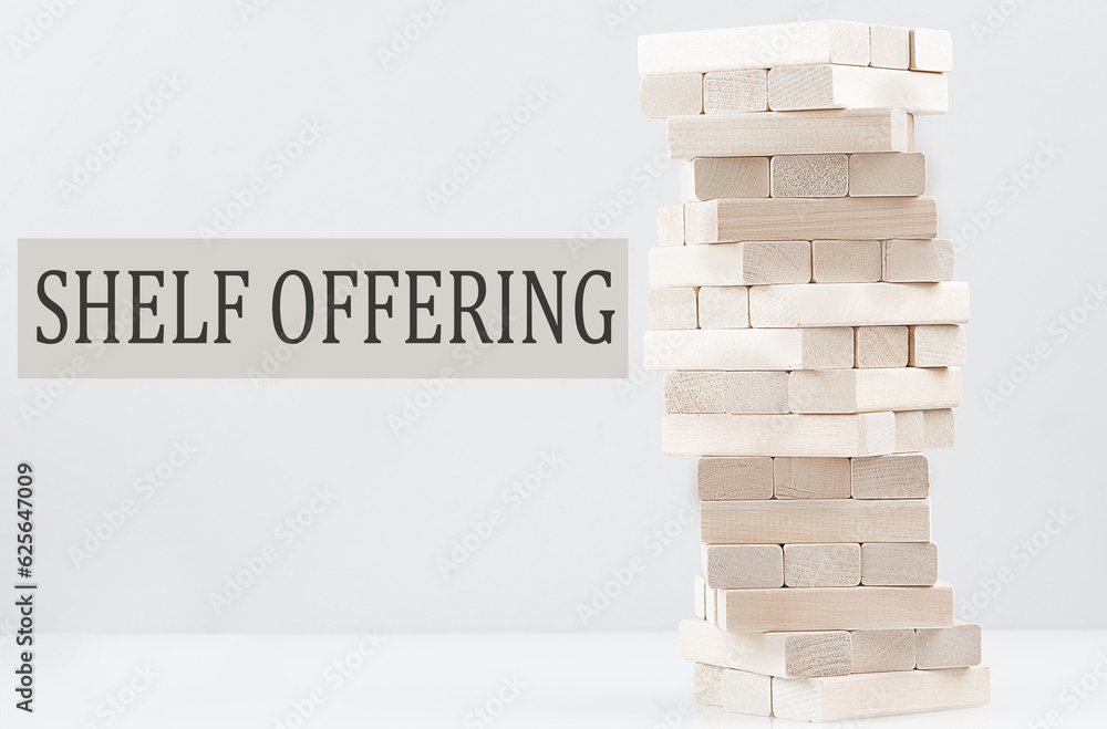 Poster shelf offering text with wooden block stack on white background , business concept