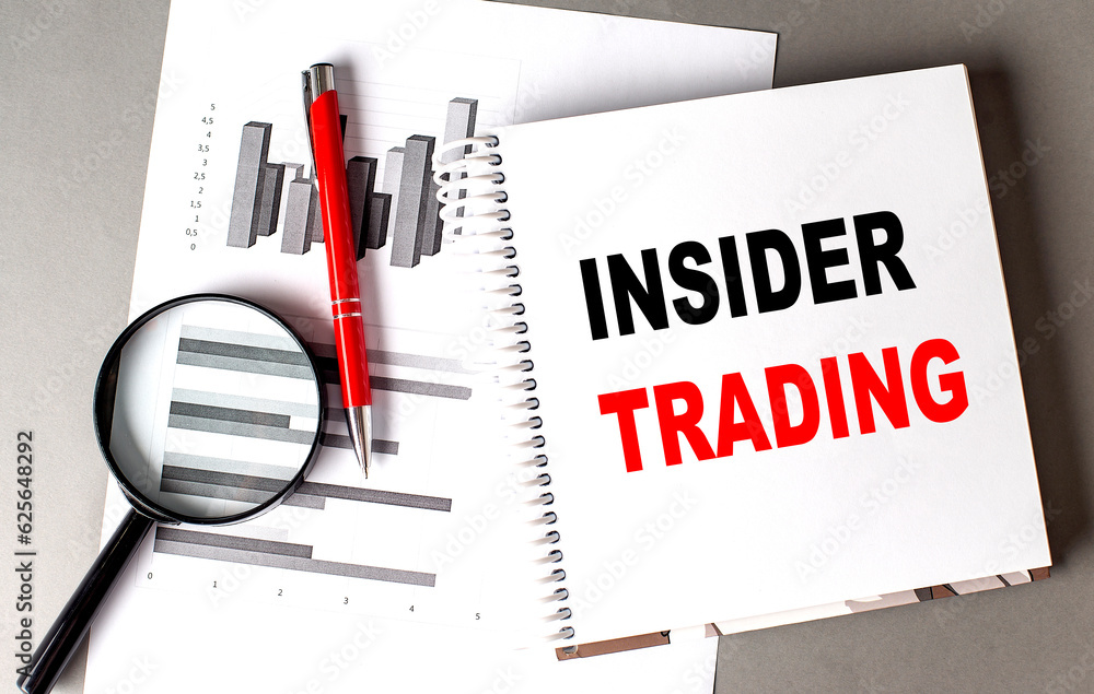 Poster insider trading text written on notebook with chart