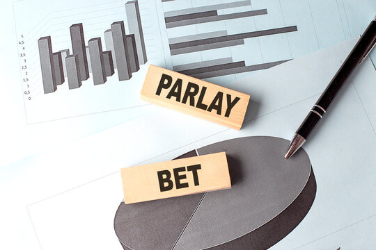 PARLAY BET text on wooden block on chart background