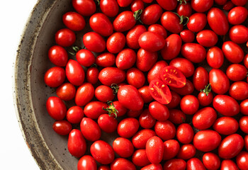 group of ripe and fresh cherry tomatoes on white. harvest. vegetable and fruit shop