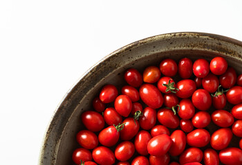 group of ripe and fresh cherry tomatoes on white. harvest. vegetable and fruit shop