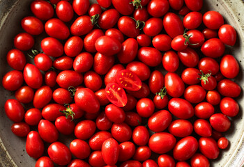 group of ripe and fresh cherry tomatoes on white. harvest. vegetable and fruit shop