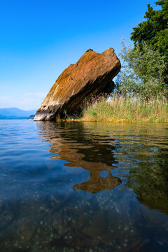 &ldquo;Sasso Cavallazzo&ldquo; is a rock on the shore of &ldquo;Lago Maggiore&ldquo; lake in northern Italy. Natural attraction and remain of ice age left by glaciers. Bathing spot and climbing attraction near Ranco Angera.