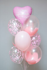 pink balloons in a glass