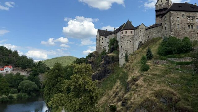 Panoramic view of Loket castle and Tepla river in Czech Republic in summer