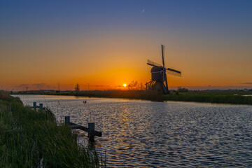 Sunset with windmill Broekmolen, Molenlanden - Nieuwpoort, The Netherlands