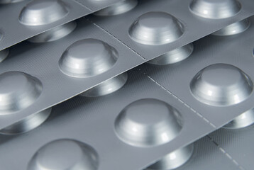 Tablets in a silver blister packs close up