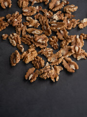 walnuts on black background, Healthy nuts background