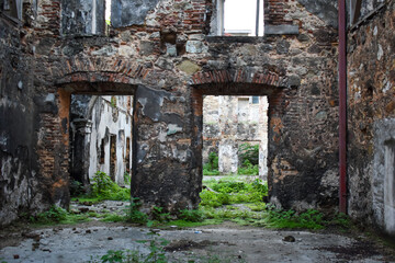 Fototapeta na wymiar ancient abandoned brick old building with crumbling walls