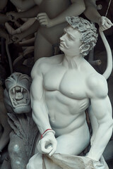 clay made idol of demon Mahishasura who fights Hindu Goddess Durga, on display inside artisan's...