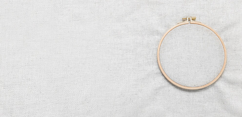 Wooden embroidery hoop with canvas. Banner for design - obrazy, fototapety, plakaty